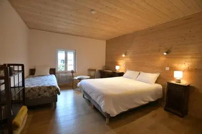 Un ou plusieurs lits dans un hébergement de l'établissement Chambre d'hôte L'Oiseau Blanc