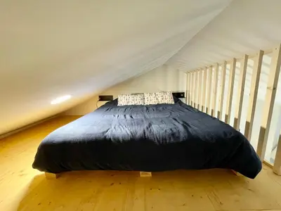 Un ou plusieurs lits dans un hébergement de l'établissement Studio cosy en pleine campagne