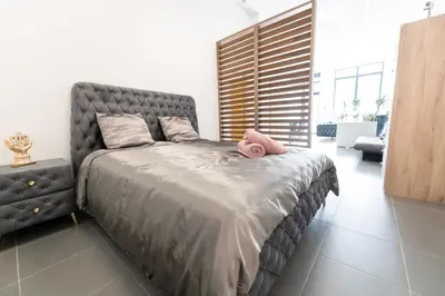 Un ou plusieurs lits dans un hébergement de l'établissement LOFT LA MINE D'OR - Parking gratuit et privé - Wifi - Tout équipé - Machine à laver