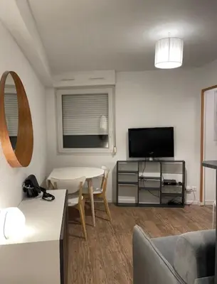 Télévision ou salle de divertissement dans l'établissement Cosy Studio 16m2