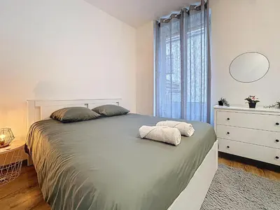 Un ou plusieurs lits dans un hébergement de l'établissement Appartement Cosy Saint-Chamond
