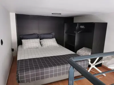 Un ou plusieurs lits dans un hébergement de l'établissement Studio mezzanine Lyon