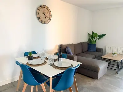 Coin salon dans l'établissement Appartement Les Hauts du Beaujolais