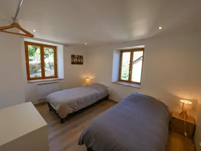 Un ou plusieurs lits dans un hébergement de l'établissement Gite de la Source-maison climatisée