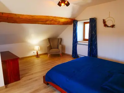 Un ou plusieurs lits dans un hébergement de l'établissement Gite de la Source-maison climatisée