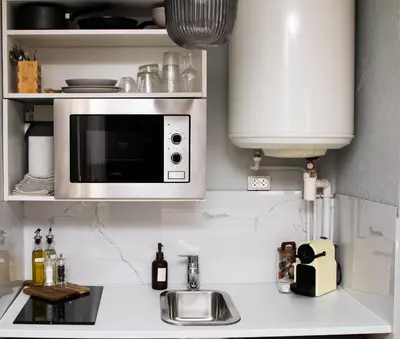 Cuisine ou kitchenette dans l'établissement StudioEurexpo - spacieux & confort