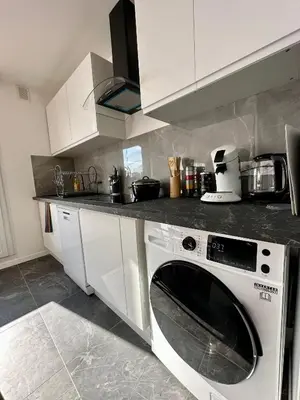 Cuisine ou kitchenette dans l'établissement Appartement 3 chambres - Proche metro