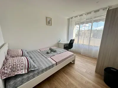Un ou plusieurs lits dans un hébergement de l'établissement Appartement 3 chambres - Proche metro