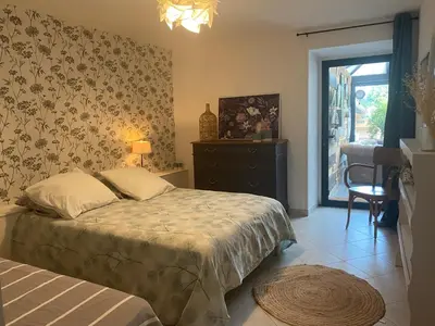 Un ou plusieurs lits dans un hébergement de l'établissement Maison Sur Véranda