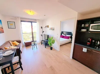 Un ou plusieurs lits dans un hébergement de l'établissement Le Valmy: appartement lumineux au pied du métro
