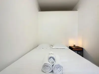 Un ou plusieurs lits dans un hébergement de l'établissement Cosy appart Lyon Part Dieu Félix 2