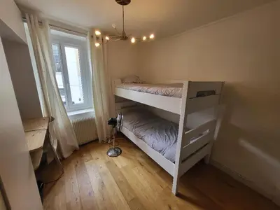 Un ou plusieurs lits dans un hébergement de l'établissement Superbe 100 M2, 4 chambres
