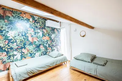 Un ou plusieurs lits dans un hébergement de l'établissement *Maison Lyon Confluence* dans jolie copropriété
