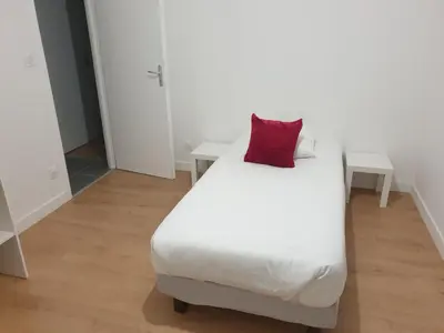 Un ou plusieurs lits dans un hébergement de l'établissement MAISON B