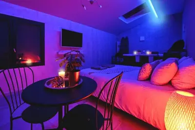 Un ou plusieurs lits dans un hébergement de l'établissement Le Lux Spa