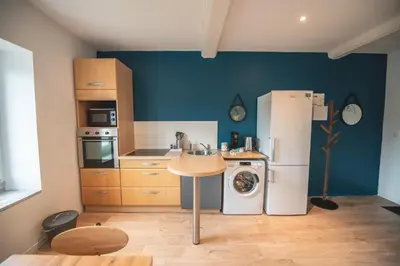 Cuisine ou kitchenette dans l'établissement KASA SURF - Wifi TV & Cosy