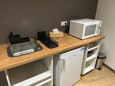 Cuisine ou kitchenette dans l'établissement La Cigogne