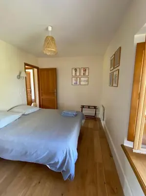 Un ou plusieurs lits dans un hébergement de l'établissement Maison confortable et calme, 2 chambres