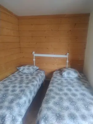 Un ou plusieurs lits dans un hébergement de l'établissement Le petit chalet