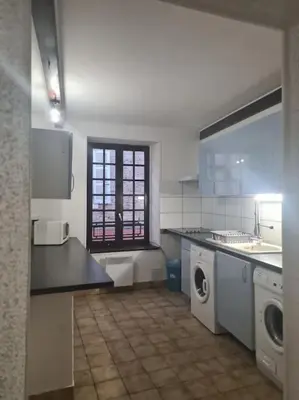 Cuisine ou kitchenette dans l'établissement Appartements T2