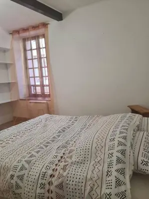 Un ou plusieurs lits dans un hébergement de l'établissement Appartements T2