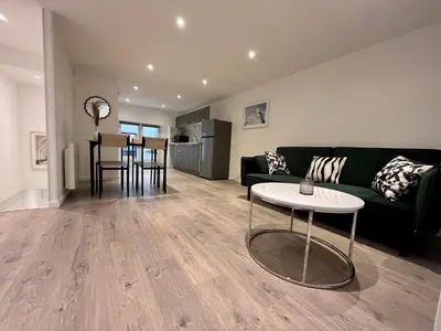 Coin salon dans l'établissement Suite Maël - Appartement 4 personnes - Check in h24 & Wifi