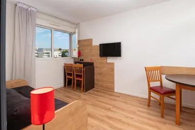 Télévision ou salle de divertissement dans l'établissement Apparthotel Privilodges Lyon Lumière