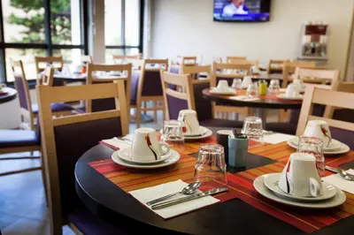 Restaurant ou autre lieu de restauration dans l'établissement Apparthotel Privilodges Lyon Lumière