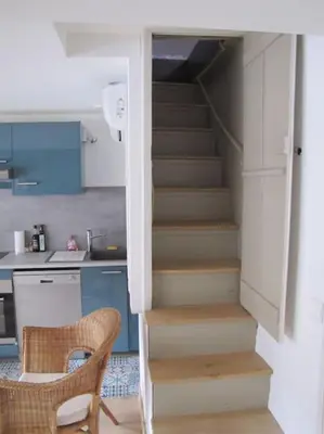 Cuisine ou kitchenette dans l'établissement Tiny duplex climatisé