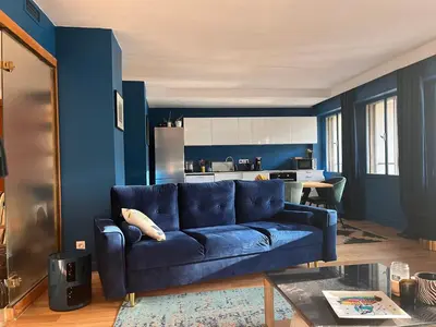 Coin salon dans l'établissement Appartement spacieux 2 chambres avec vue sur le Rhône et parc