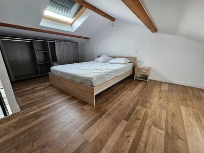 Un ou plusieurs lits dans un hébergement de l'établissement appartement guy