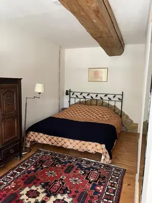 Un ou plusieurs lits dans un hébergement de l'établissement Loft dans un château en pierres dorées