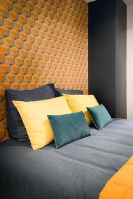 Un ou plusieurs lits dans un hébergement de l'établissement Studio cosy avec parking