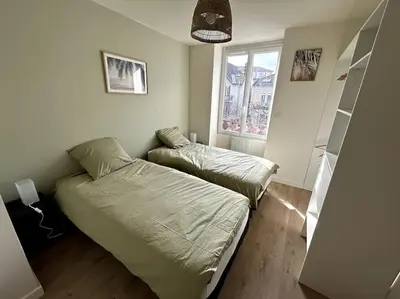 Un ou plusieurs lits dans un hébergement de l'établissement Appartement lumineux en centre-ville / Proche Gare