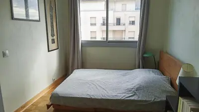 Un ou plusieurs lits dans un hébergement de l'établissement Appartement familial 2 chambres