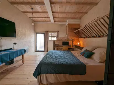 Un ou plusieurs lits dans un hébergement de l'établissement Logement - Studio indépendant à Pérouges