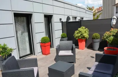 Coin salon dans l'établissement La Bonneterie Appartement de charme avec terrasse