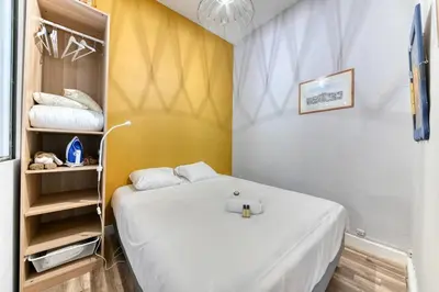 Un ou plusieurs lits dans un hébergement de l'établissement Le Garden City - Bel appartement avec jardin privé