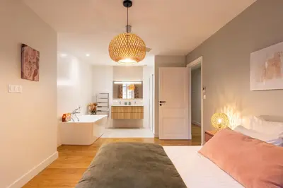 Un ou plusieurs lits dans un hébergement de l'établissement Cœur Presqu'île Appartement spacieux AC