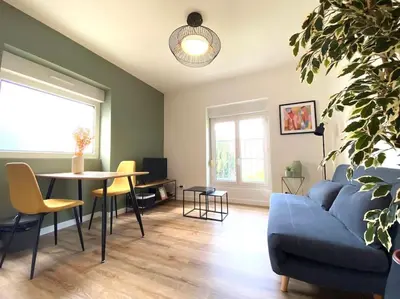 Coin salon dans l'établissement Appartements avenue général Leclerc