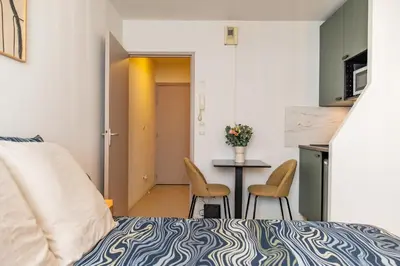 Un ou plusieurs lits dans un hébergement de l'établissement Villeurbanne Centre Appartement Meublé