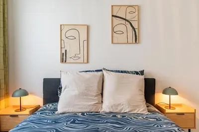 Un ou plusieurs lits dans un hébergement de l'établissement Villeurbanne Centre Appartement Meublé