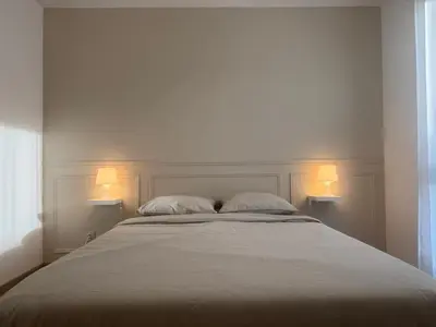 Un ou plusieurs lits dans un hébergement de l'établissement Appartement cosy à Bron