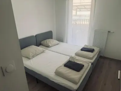 Un ou plusieurs lits dans un hébergement de l'établissement Appartement cosy à Bron