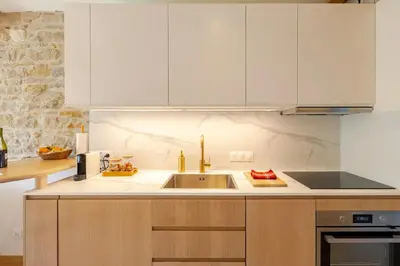 Cuisine ou kitchenette dans l'établissement Moulin du Buis - Bain nordique, charme et détente