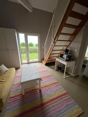 Coin salon dans l'établissement Chambre Serenity