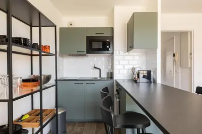 Cuisine ou kitchenette dans l'établissement L'élégant - Desaugiers