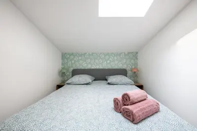 Un ou plusieurs lits dans un hébergement de l'établissement Casa Azul - Belle maisonnette colorée - Garibaldi