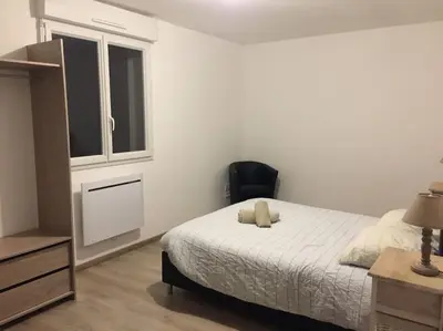 Un ou plusieurs lits dans un hébergement de l'établissement MONTALIEU SEJOUR Maison Les Lys