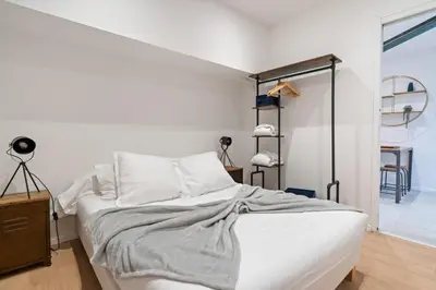 Un ou plusieurs lits dans un hébergement de l'établissement Loft MEHARI - Le Méridien #Parking #Lave-linge #Clim #Netflix